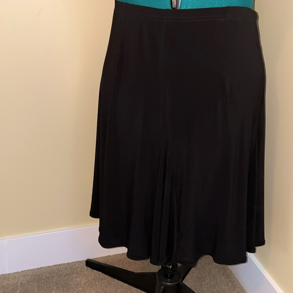 Flouncy skirt in stretch fabric is in excellent condition.